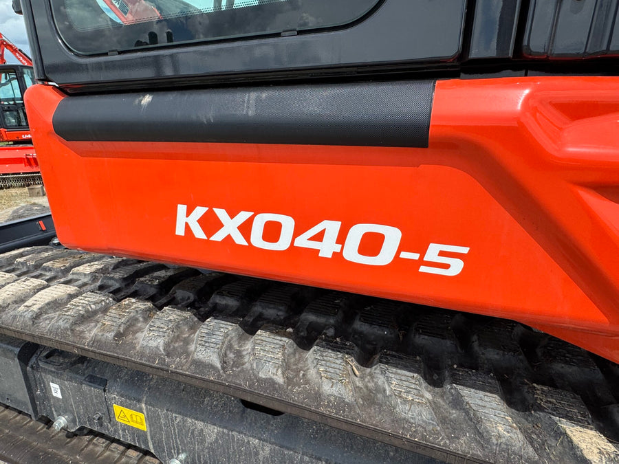 Kubota KX040-5 model decal on the side panel above the rubber track