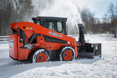 Kubota SSV75 skid steer rear view snow blower throwing snow
